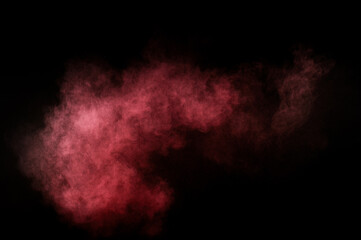 Red and pink powder explosion.Red and pink powder explosion on black background. Colored powder cloud. Colorful dust explode. Paint Holi.
