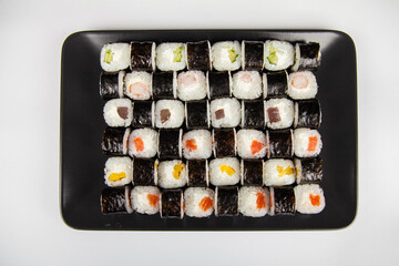 Hoso sushi set and sushi rolls. Various sushi and rolls with fish cheese. Isolated over white background.
