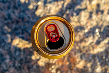 open beer can on a stone