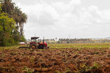 Tractor and tiller, plower used in agriculture Machinery used in the field for paddy cultivation