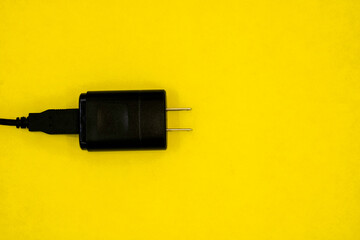 Black plug to charge devices with usb cable