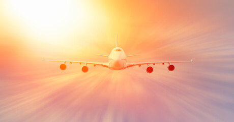Airplane with motion blur effect at sunset. Landscape with passenger airplane is flying. Aircraft with blurred background
