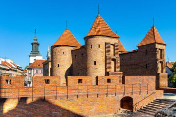 Fototapeta na wymiar Warsaw Barbican fortified outpost as part of brick and stone historic defence walls in Stare Miasto Old Town quarter of Warsaw, Poland