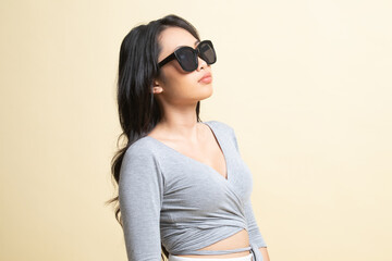 Fototapeta premium Portrait of a beautiful young asian girl in sunglasses.
