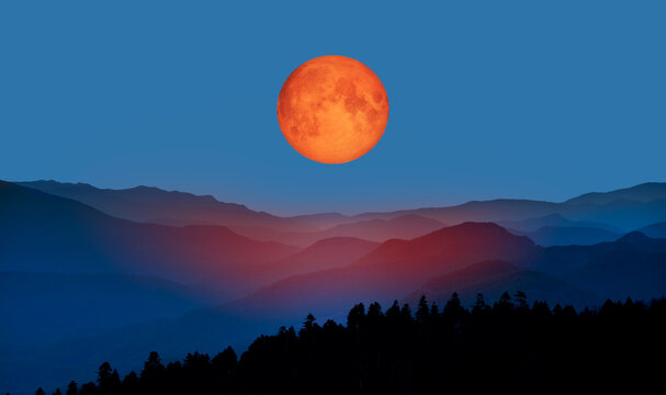 Bloody moon of Total Lunar Eclipse with blue mountains "Elements of this image furnished by NASA "