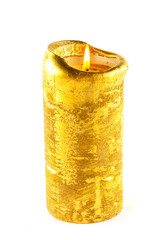 Large Golden burning candle isolated on white background.