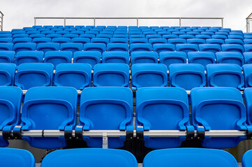 Blue plastic seats at the tribune