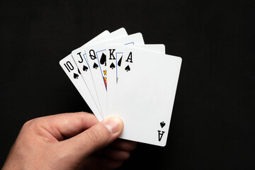Royal flush combination in poker on black background. Poker  combinations concept.