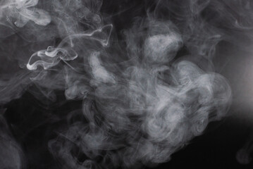 White steam on a black background.