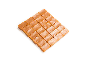 Tasty caramel candy isolated on white background.