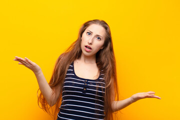yound blonde woman feeling puzzled and confused, unsure about the correct answer or decision,...