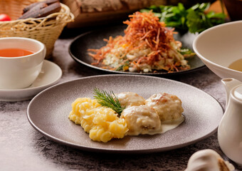 set of various plates of food top view, lunch. Spaghetti pasta carbonara, salad, meatballs, mashed potatoes, traditional creamy gravy, bread, tea. Healthy and mouth-watering three variation lunch.