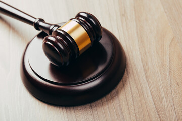 Symbol of law and justice on wooden table in lawyer office