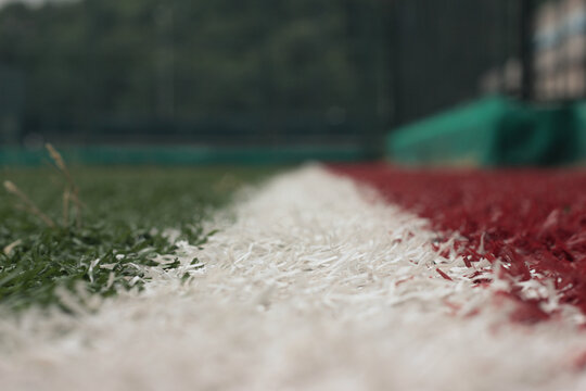 green white and redd fotball grass