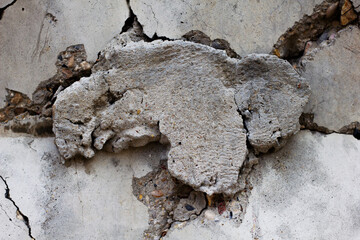 Stone wall textured background close-up. Texture of the stone. Frozen cement on a gray wall. Construction work.