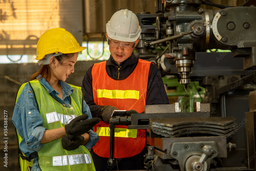 Aufkleber factory worker and engineer as team working in a factory.