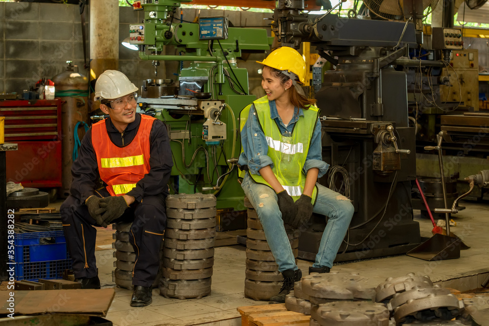 Poster group portrait of a team of engineers working at industrial factory.