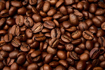 Roasted black coffee grains, can be used as background.