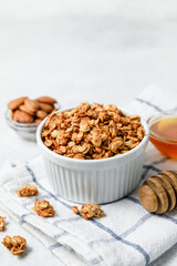 Homemade oatmeal granola bowl on white background.