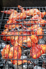close up of cooked grilled chicken wings. Tasty local food.
