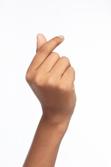 Hand of woman show gesture fingers symbol of love, mini heart, studio light shooting isolated on white background