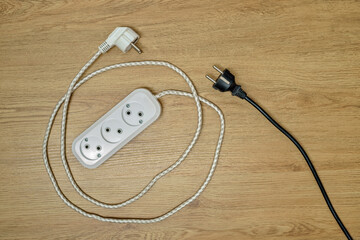 Electrical extension cord, electric wire with plug and socket, top view