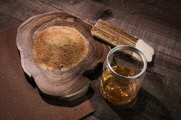 White shellac powder, which is mixed with alcohol for applying on wood to coat the surface of wood in furniture. Selective focus on the powder.