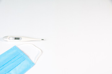 Tablets And A Protective Blue Mask Lie On A White Background