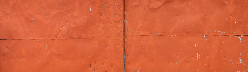 Panorama with red iron sheets. Texture of old rusty painted metal. Metal corrosion. Template for the designer, banner