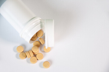 Tablets And A Protective Blue Mask Lie On A White Background
