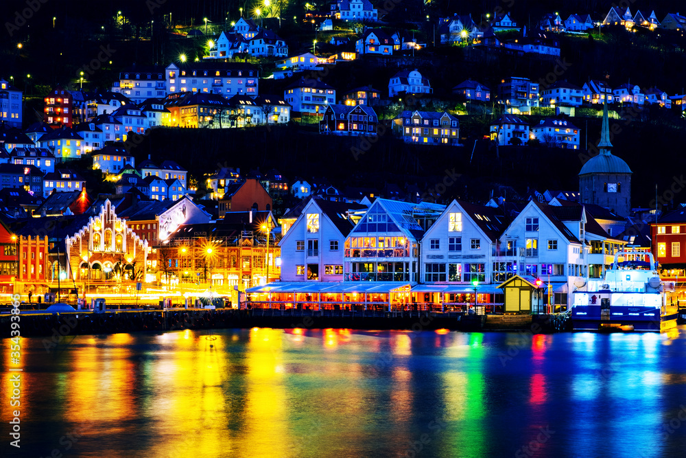 Poster view of harbour old town bryggen in bergen, norway during the night