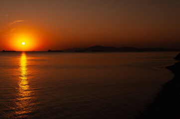 A sunset over a body of water
