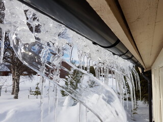 clear icicles hanging from a roof