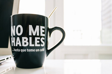 Don't Talk to Me Until I've Had My Coffee. Mug with Message in Spanish: No me hables hasta que tome...