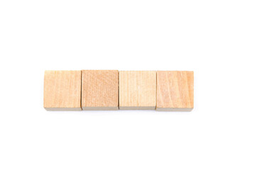 Wooden cubes on a white background. Four identical cubes lie, stand in a row together and separately, directly and at an angle. Place for text