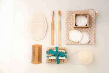Top view personal hygiene products and bath SPA accessories on wooden background. Flat lay eco...