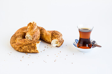 Traditional,Crunchy Turkish Bagel,Slaced Simit with Turkish Tea on the white surface with copy space