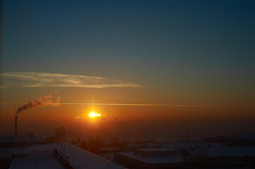A plane with a sunset in the background