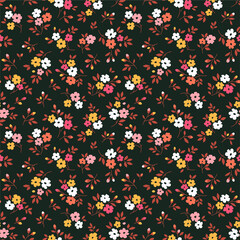 Cute floral pattern in the small flowers. Ditsy print. Motifs scattered random. Seamless vector texture. Elegant template for fashion prints. Printing with small yellow flowers. Black background.