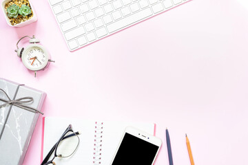 Bright pink background office desk