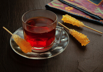 Black tea in persian style with three sugar sticks Nabat Chou.