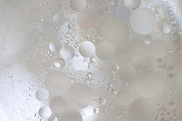 Fototapeta premium Beige tiny bubbles inside liquid macro unusual abstract wallpaper
