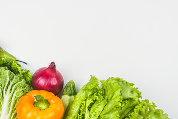 Vegetables and fruits on a white background with a copy for text. Healthy food concept.