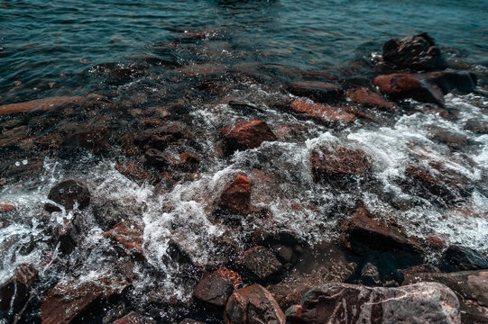 A close up of a rock near the ocean