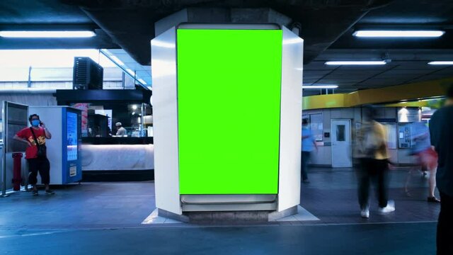 TIme-lapse Mock up blank Billboard  LED screen vertical for advertising on sky walk in Bangkok walkway on train station Public building People many walking and look Advertising banner all time.