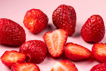 Strawberries on a pink background. Sweet red berries.