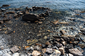 A rocky beach next to a body of water