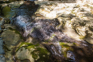 blue mountain river with a waterfall