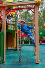 boy playing on the playground on a nice day