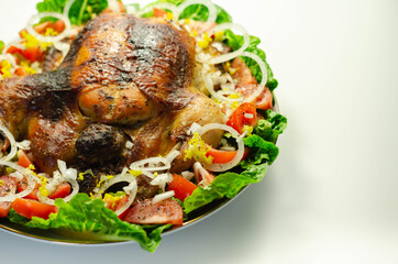 Roasted British large chicken with classic pork, sage, and onion stuffing served with little gem lettuce, tomato, and  fresh onion